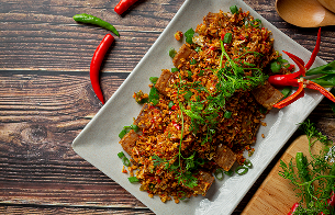 fried-pork-with-dried-chili-salt-dark-background